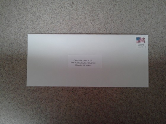 Self-Addressed Unsealed Stamped Envelope Ready for the Mail